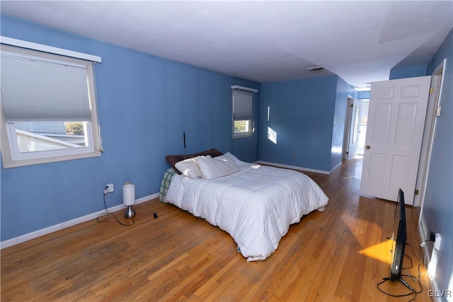 bedroom with wood-type flooring