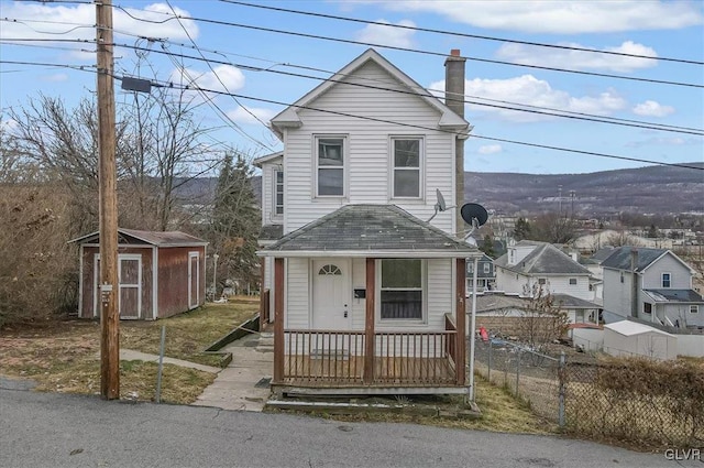 front facade with a storage shed