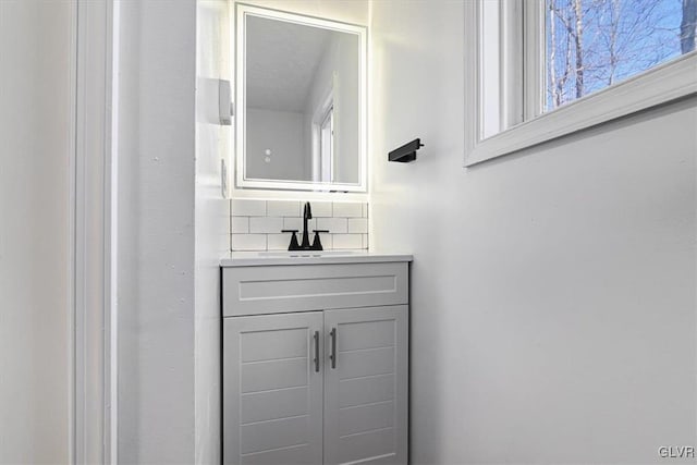 bathroom featuring backsplash and vanity