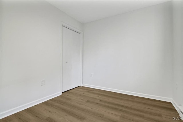 spare room featuring dark hardwood / wood-style floors