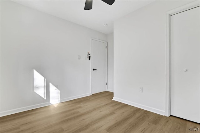 unfurnished room with ceiling fan and light hardwood / wood-style flooring