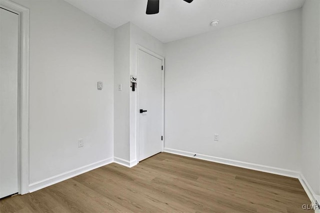 spare room with ceiling fan and light hardwood / wood-style flooring