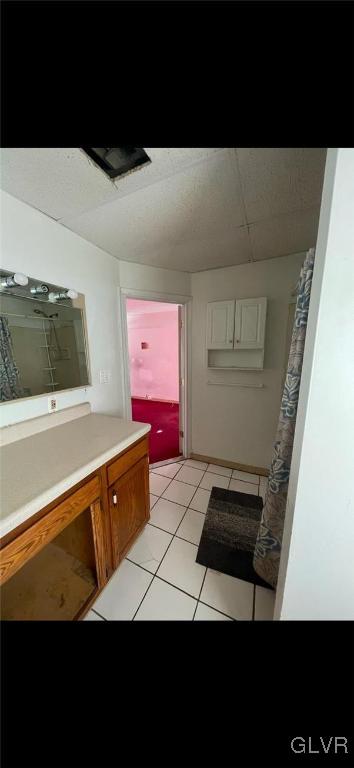 bathroom with tile patterned flooring and vanity