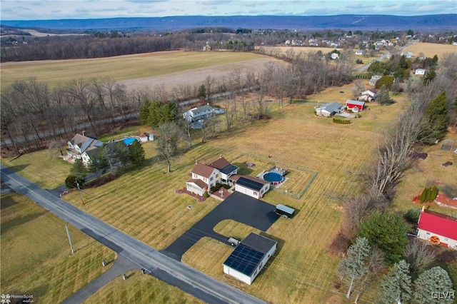 birds eye view of property featuring a rural view