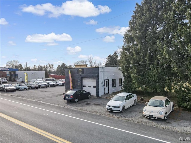 view of parking with a garage