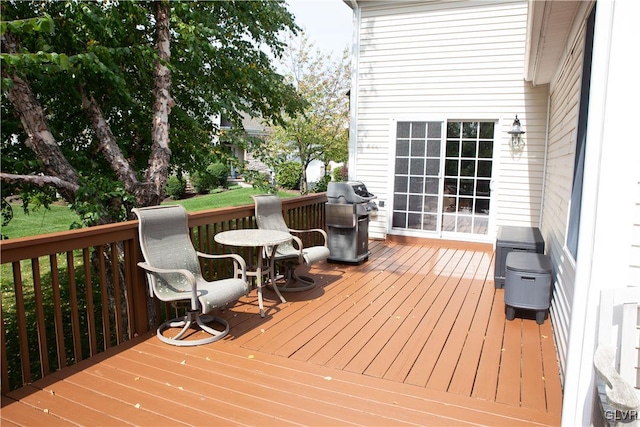 wooden deck featuring grilling area