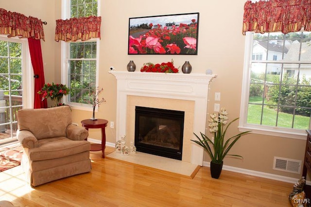 sitting room with wood-type flooring