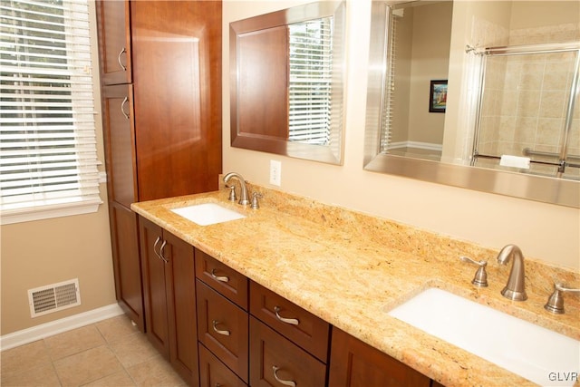 bathroom with tile patterned flooring and vanity