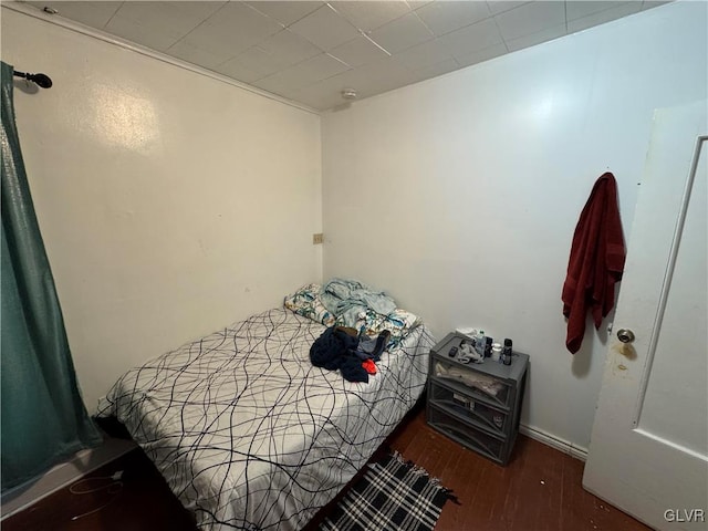 bedroom featuring dark wood-type flooring