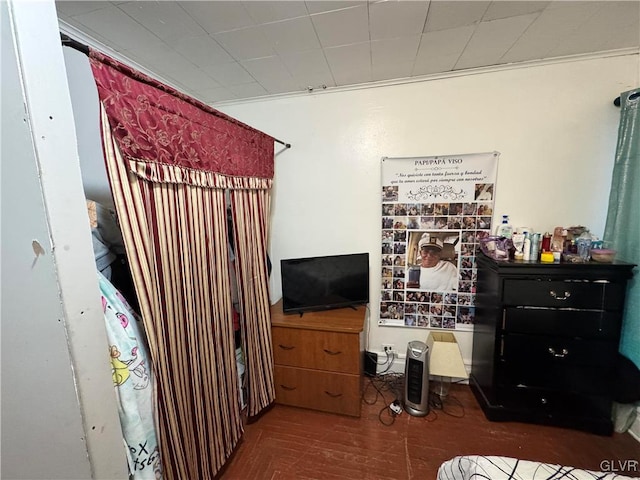 bedroom featuring crown molding