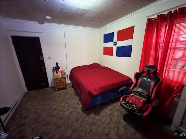 carpeted bedroom with crown molding and a baseboard radiator