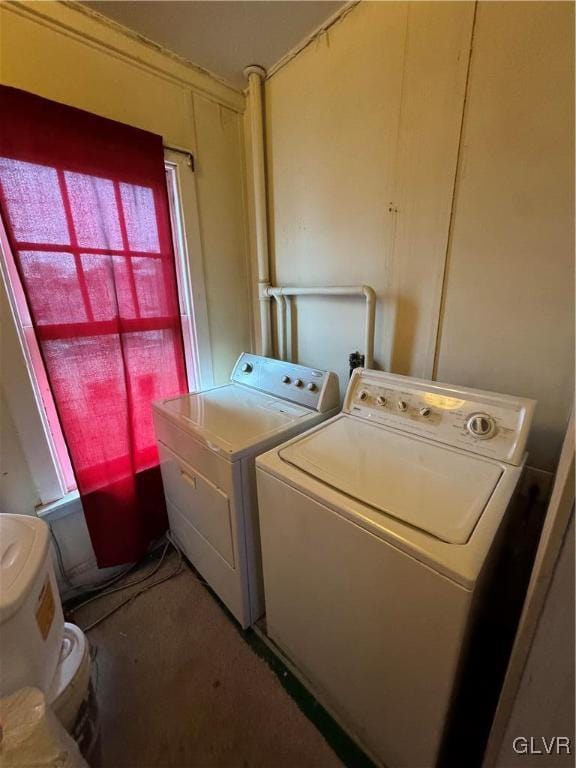 laundry room with separate washer and dryer