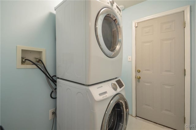 laundry room with stacked washer and clothes dryer