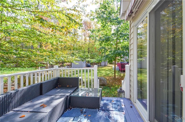 wooden terrace featuring an outdoor hangout area