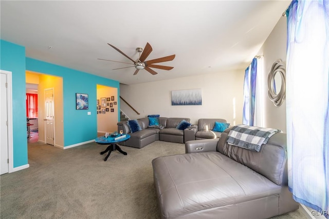 carpeted living room featuring ceiling fan