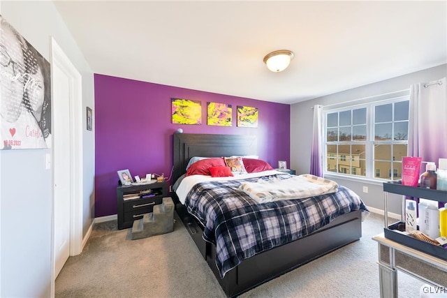 bedroom featuring carpet and multiple windows