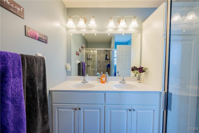 bathroom featuring vanity and an enclosed shower