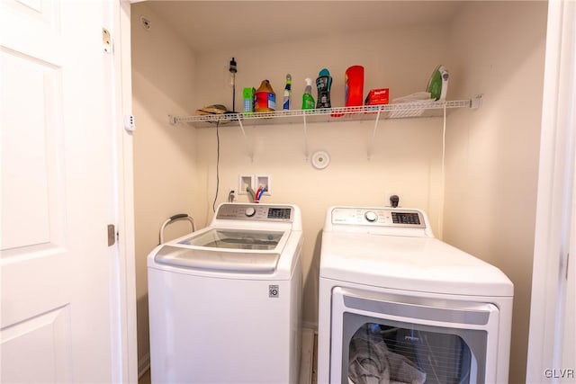 washroom with washer and dryer