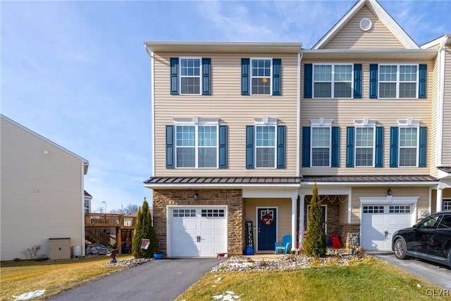 multi unit property featuring a garage