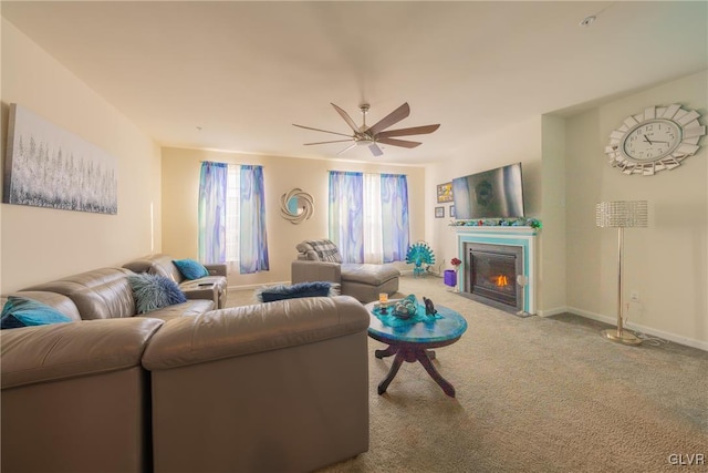 carpeted living room featuring ceiling fan