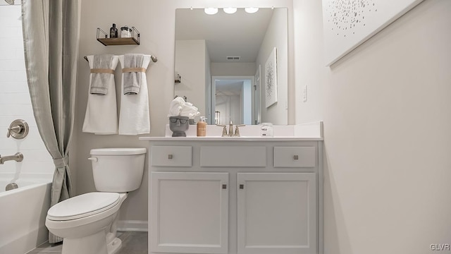 full bathroom featuring shower / bath combo, vanity, and toilet