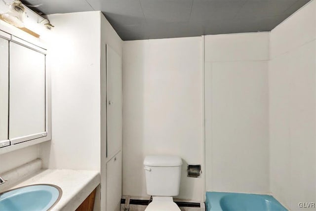 bathroom featuring vanity, a baseboard radiator, and toilet