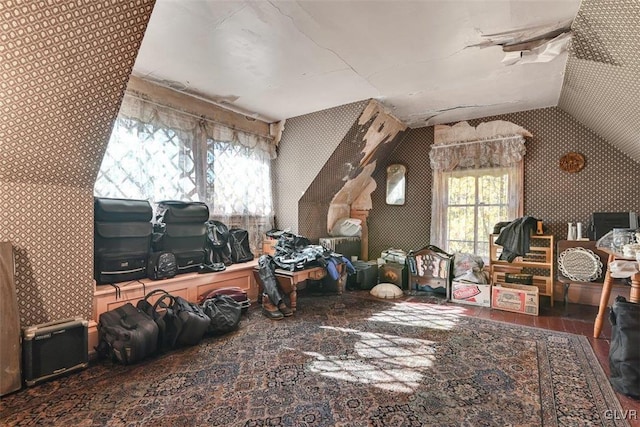 bonus room featuring plenty of natural light and vaulted ceiling