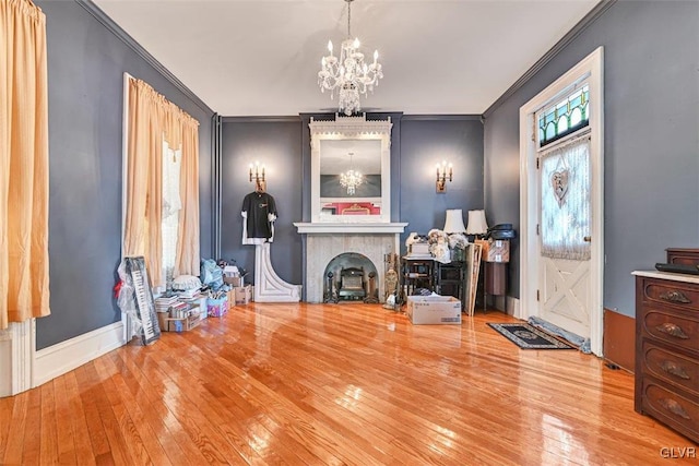 miscellaneous room featuring a healthy amount of sunlight, hardwood / wood-style flooring, and crown molding