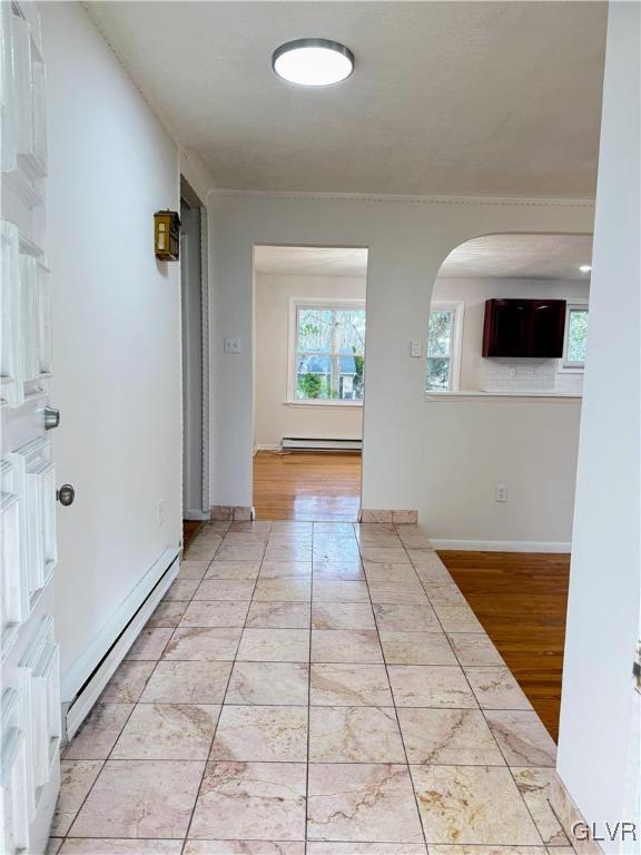 hallway featuring a baseboard radiator