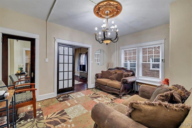 living room with an inviting chandelier