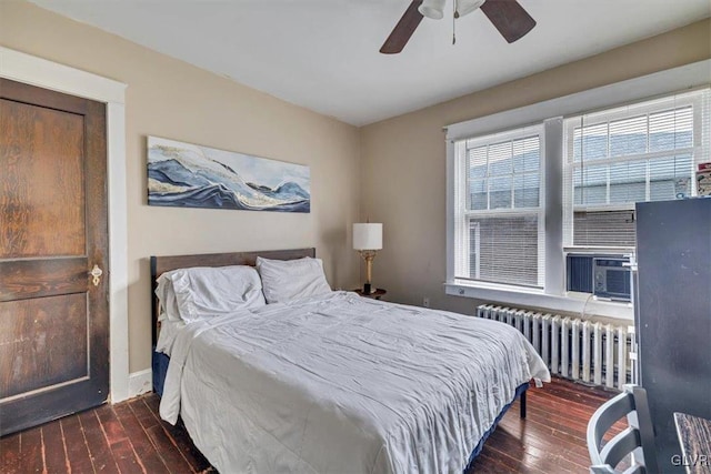 bedroom featuring ceiling fan, dark wood-type flooring, and radiator