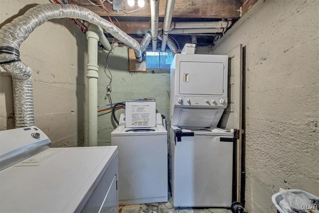 washroom with washing machine and clothes dryer