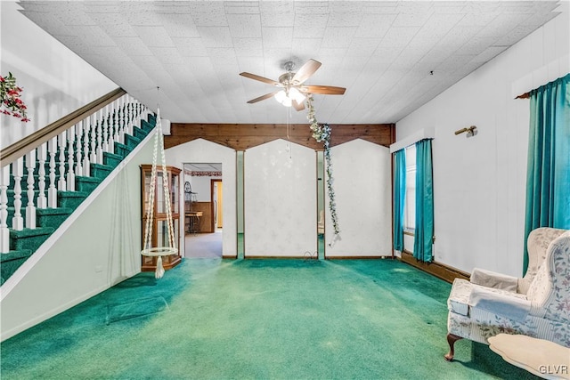 unfurnished room with ceiling fan and carpet floors