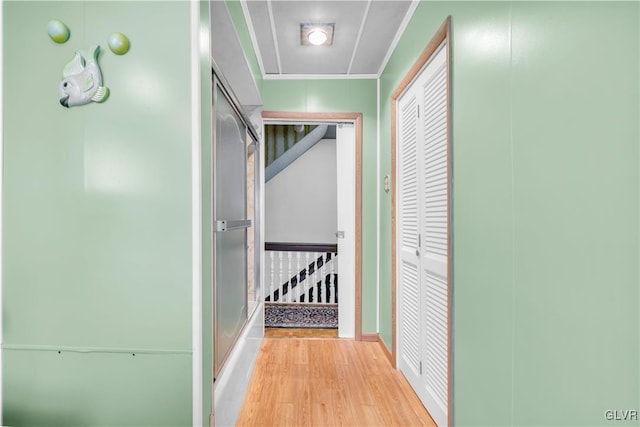 hall with light hardwood / wood-style flooring