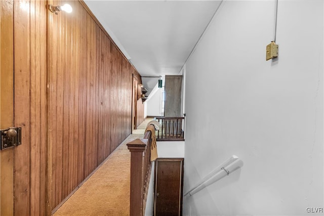 corridor with wooden walls and carpet