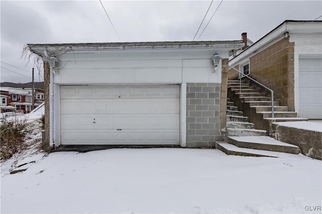 view of snow covered garage