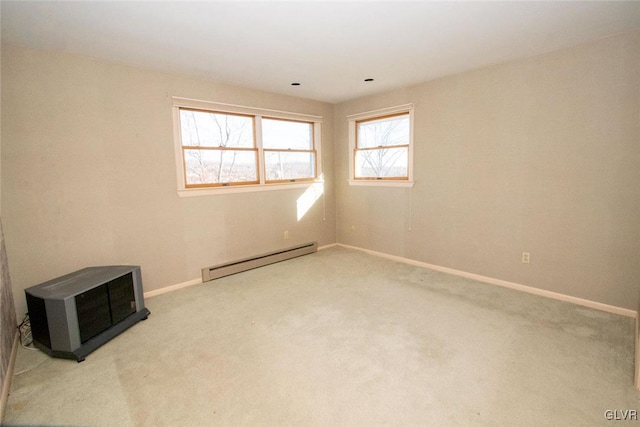 unfurnished room with carpet flooring and a baseboard radiator