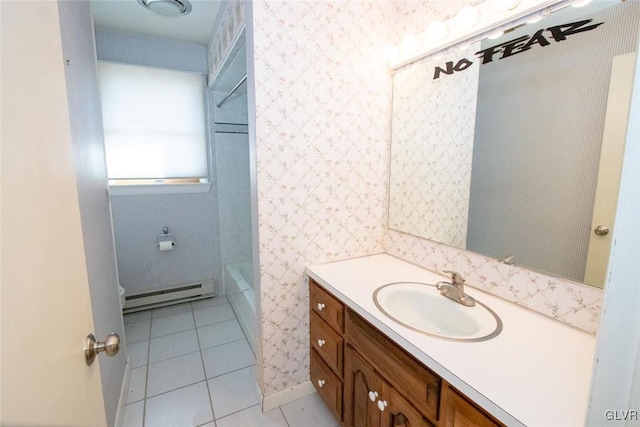 bathroom with tile patterned flooring, vanity, and a baseboard radiator