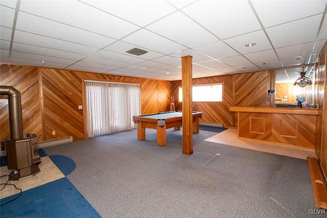 recreation room with a wood stove, carpet floors, billiards, and a baseboard heating unit