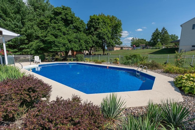 view of swimming pool with a patio area