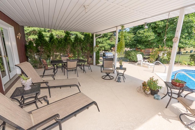 view of patio featuring a fenced in pool