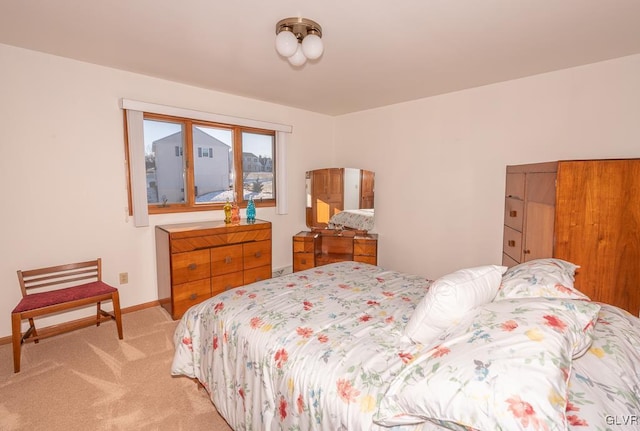 bedroom featuring light carpet