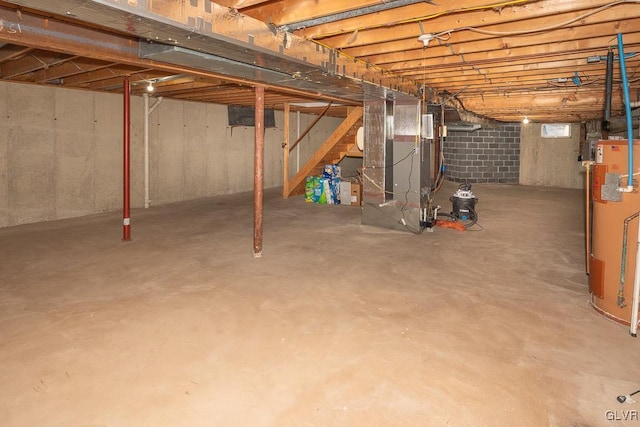 basement featuring heating unit and gas water heater