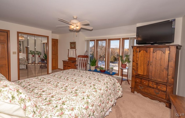 bedroom with access to outside, ceiling fan, and light colored carpet