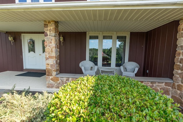 doorway to property featuring a porch