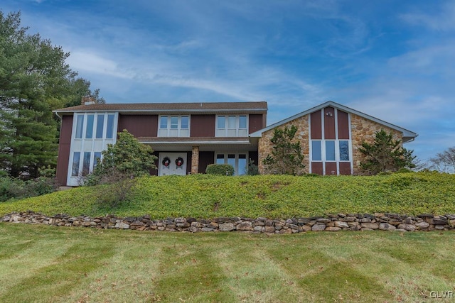 view of front property with a front lawn