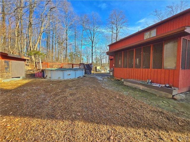 view of yard with a sunroom