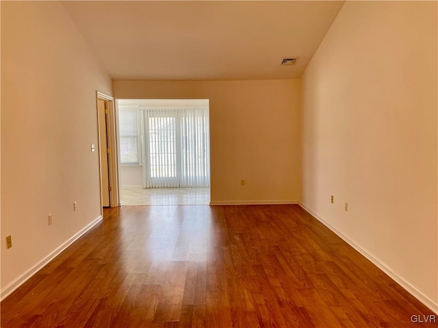 empty room featuring hardwood / wood-style floors