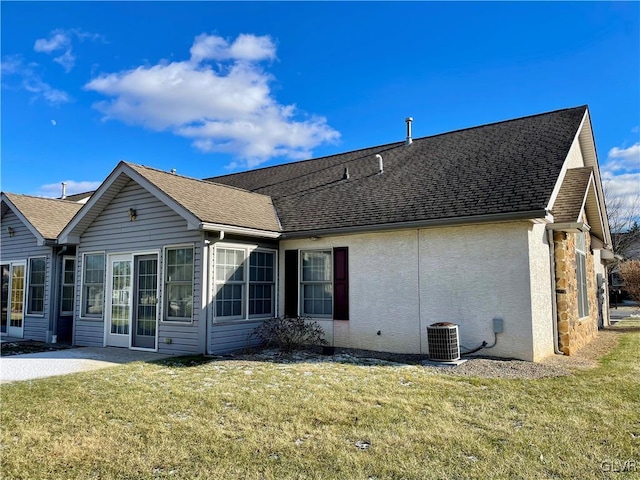 back of house with a yard, central AC unit, and a patio area