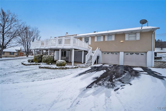 view of front facade featuring a deck and a garage